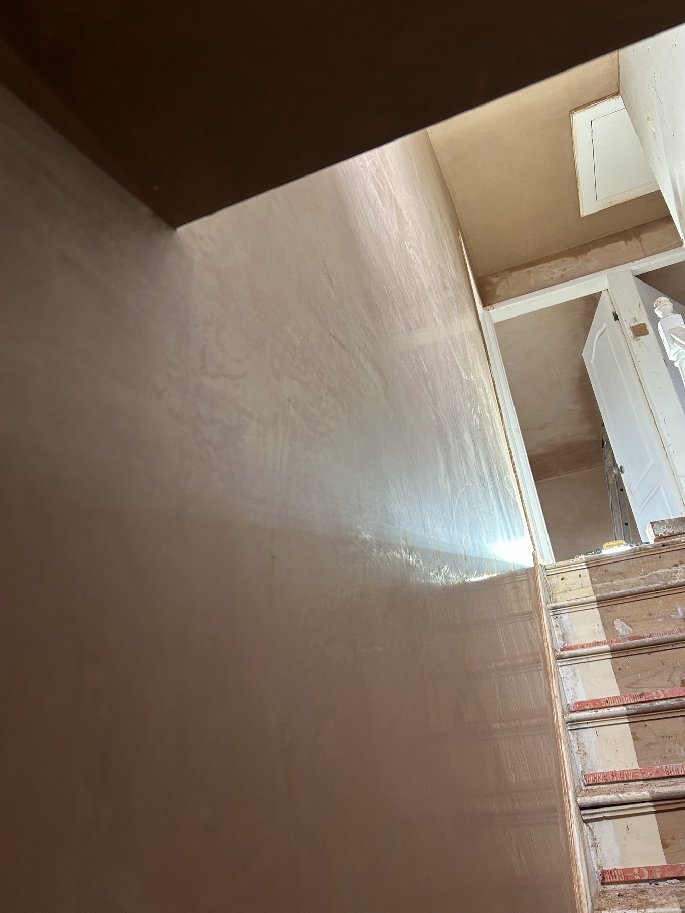 The same skimmed stairwell seen from the landing